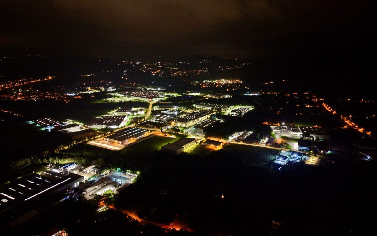 Night Aerial View Energy Complex With Illuminated Facilities, Transformer Yards And Service Roads Mapped